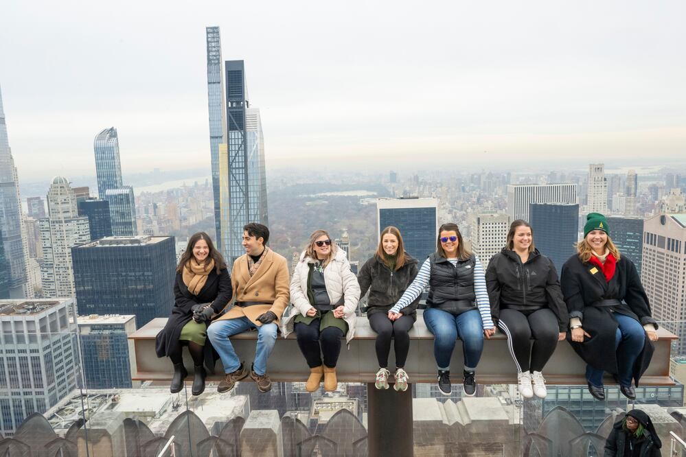 Visitors enjoy Rockefeller Center's new interactive experience "The Beam" at Top of the Rock Observation Deck. (Diane Bondareff/AP Images for Tishman Speyer)