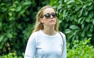 Amber Heard luce elegante y glamorosa con look braless en paseo por Madrid